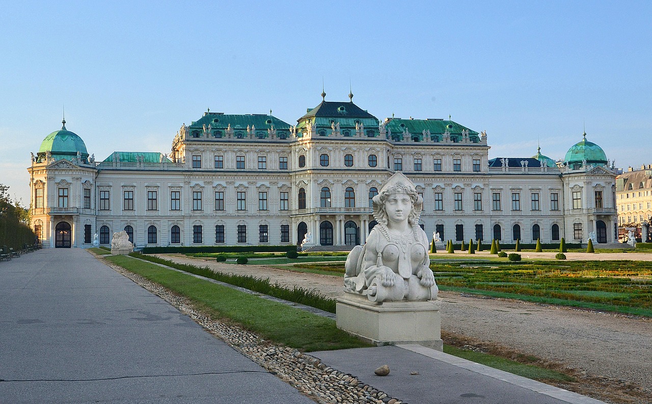 Sphinx sculpture at Belvedere Palace Vienna with baroque architecture and garden