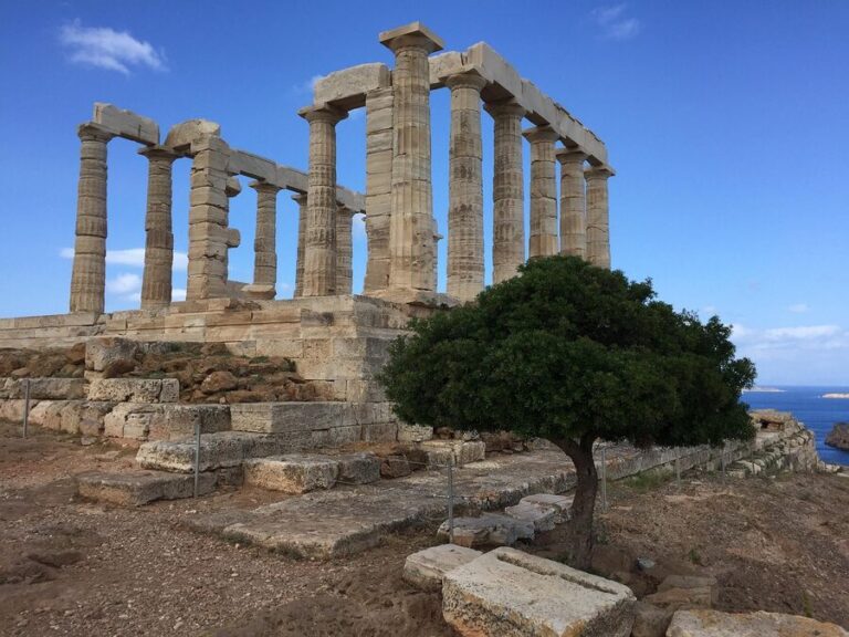 Ancient Temple of Poseidon with Doric columns overlooking the Aegean Sea at Cape Sounion