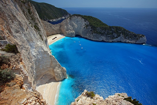 Panoramic view from the Navagio Beach viewpoint showing the shipwreck cove and surrounding cliffs