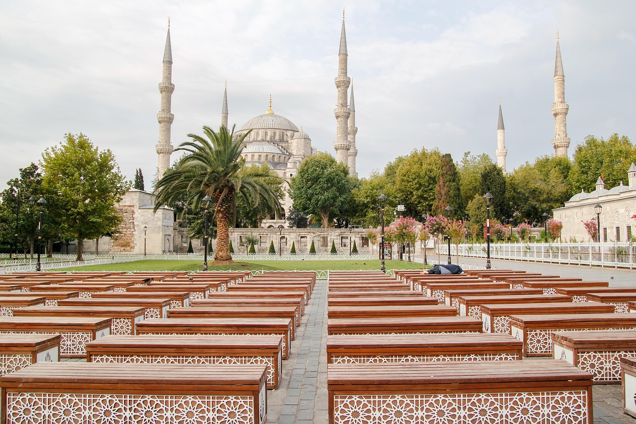 Blue Mosque with its minarets reflected in dramatic light at sunset