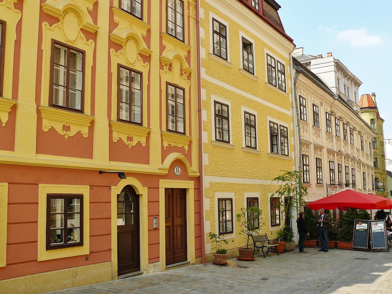 Vienna row of houses with colourful facades and street cafes