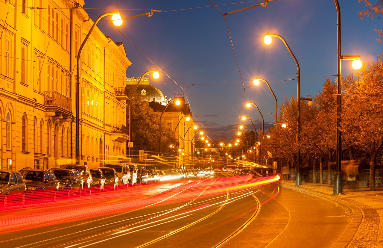 Prague streets with warm evening lights and historic buildings