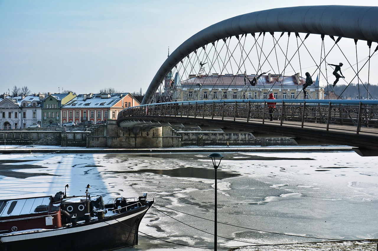 A bridge spanning the Vistula River in Krakow with the Kazimierz district in the background