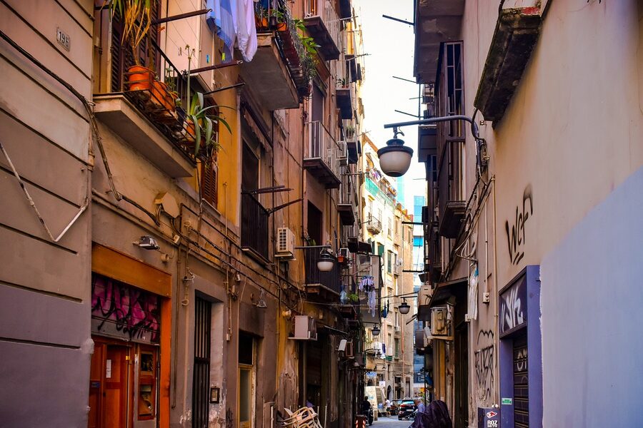 Typical narrow street with old buildings in the historic centre of Naples Italy