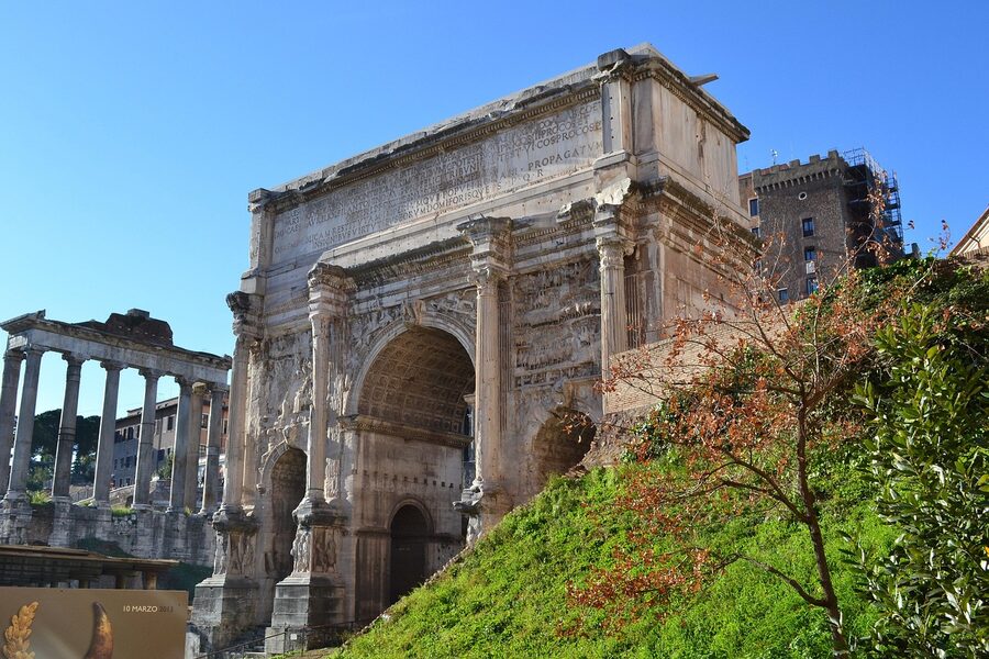 Columns and arches of the Roman Forum with ancient stone architecture and a portico