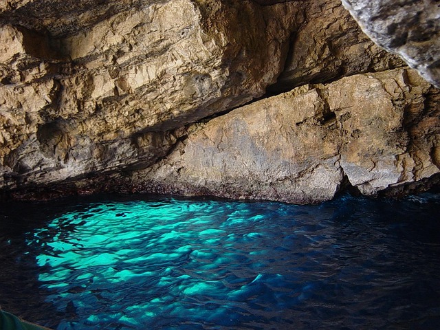 Blue light reflecting inside a sea cave on Zakynthos island