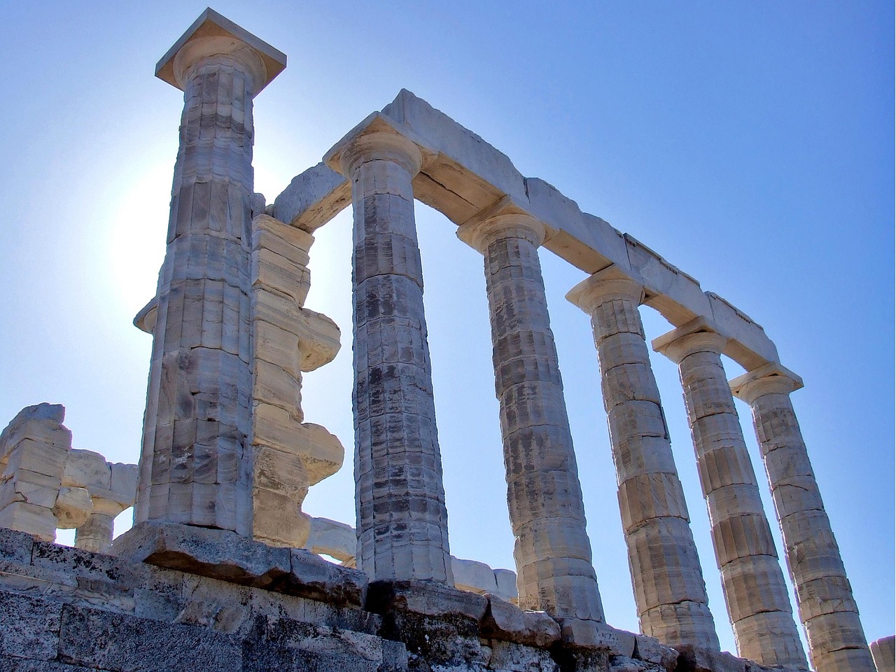 Close-up of white marble Doric columns at the Temple of Poseidon in Sounion Greece