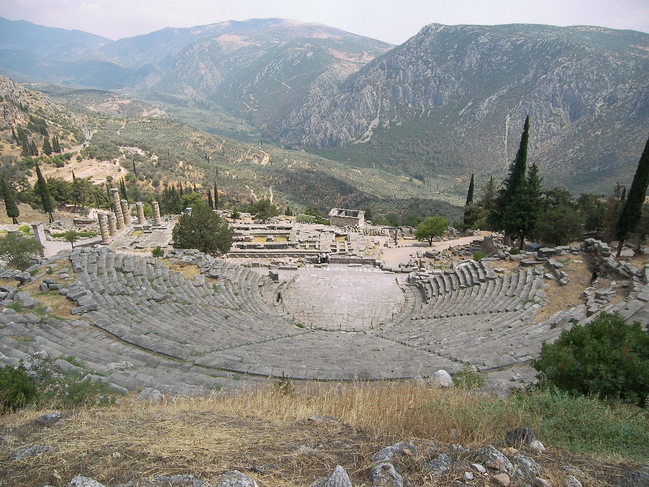 Stone seats of the ancient theatre at Delphi with panoramic valley views