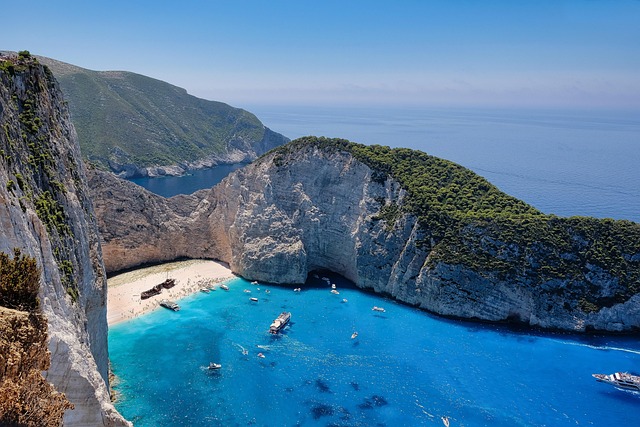 Aerial view of the turquoise cove at Navagio Beach Zakynthos surrounded by white cliffs
