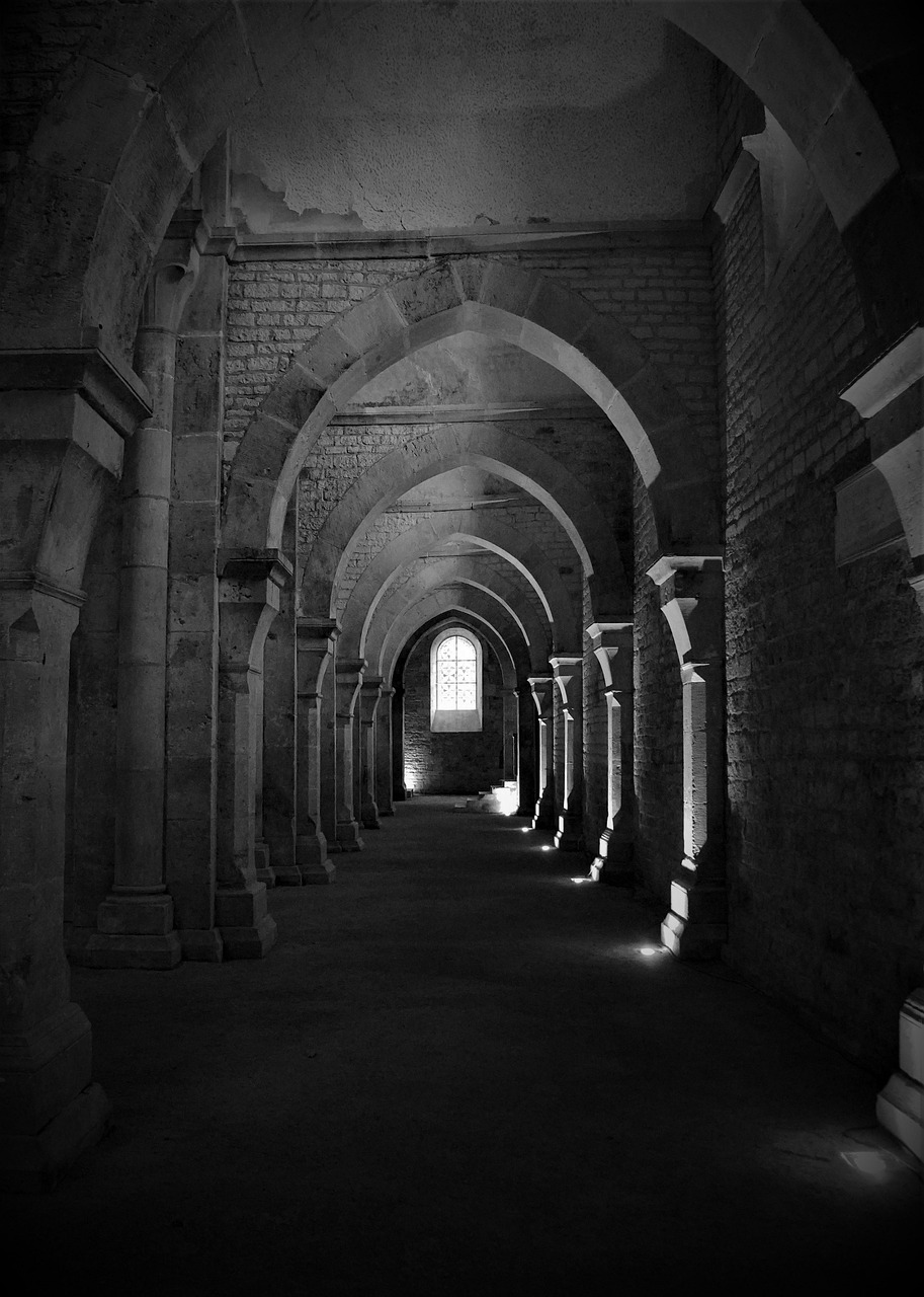 Stone tunnel corridor with arched ceiling in an underground passage