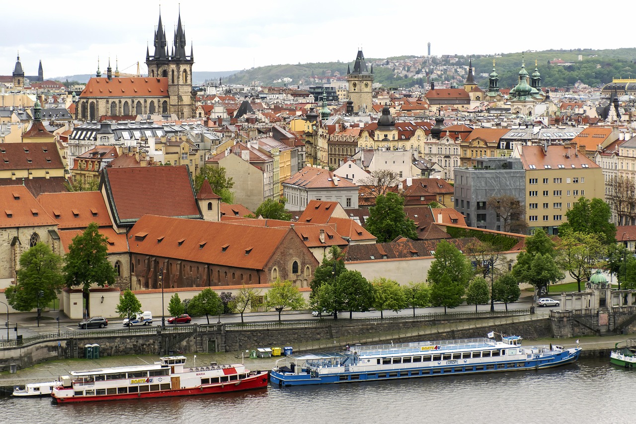Vltava River flowing through Prague with urban architecture on both banks
