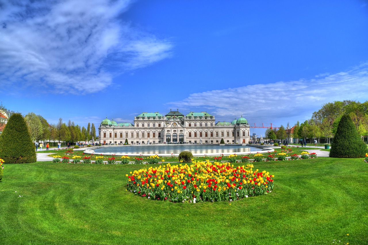 Belvedere Palace gardens and fountains with green lawns and baroque palace in Vienna