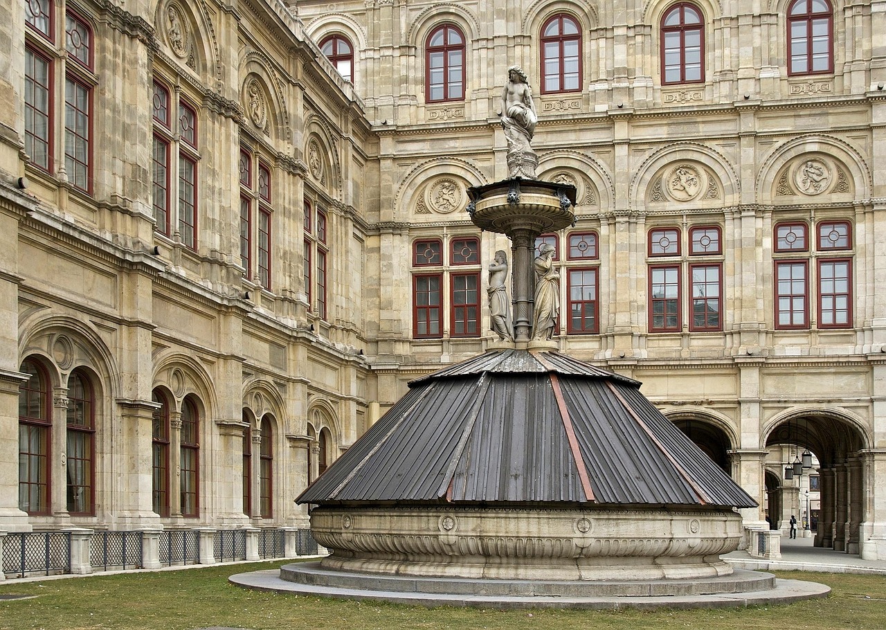 Vienna State Opera House exterior with statue