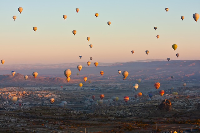 Cappadocia fairy chimneys with hot air balloons in the sky above
