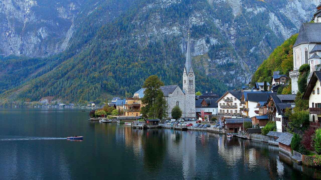 Hallstatt church and colorful houses along the mountain slope