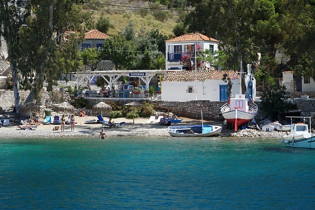 A cove on Hydra island with a waterfront tavern and moored yachts