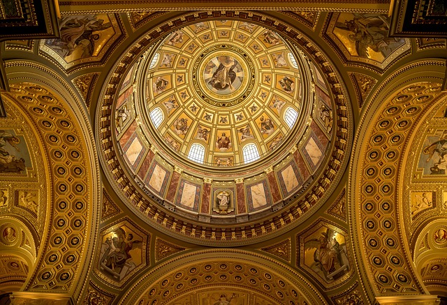 Detailed view of the basilica nave interior showing marble columns and religious artwork