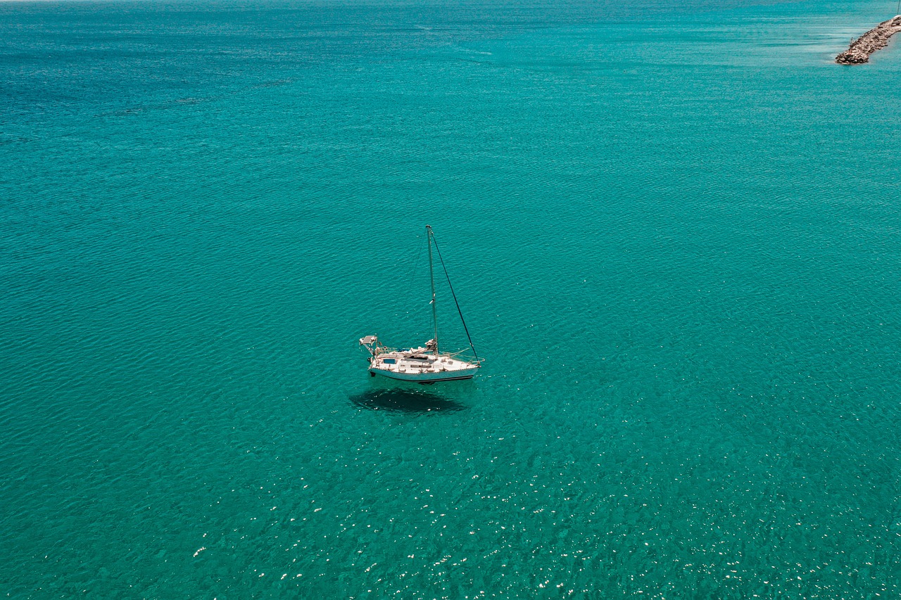 A cruise vessel docked at the Kos harbor pier with passengers boarding