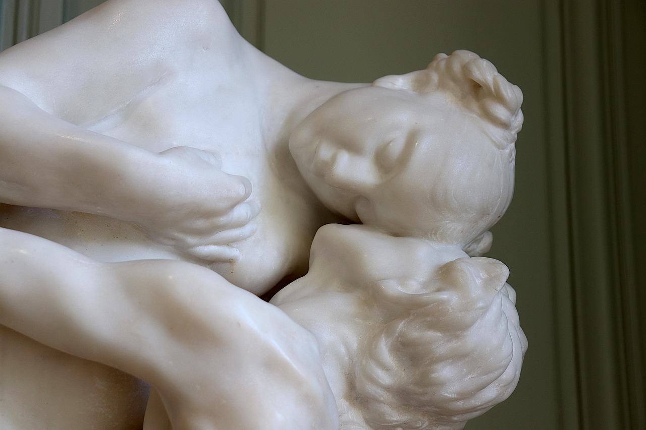 White marble sculpture by Auguste Rodin showing two reclining figures