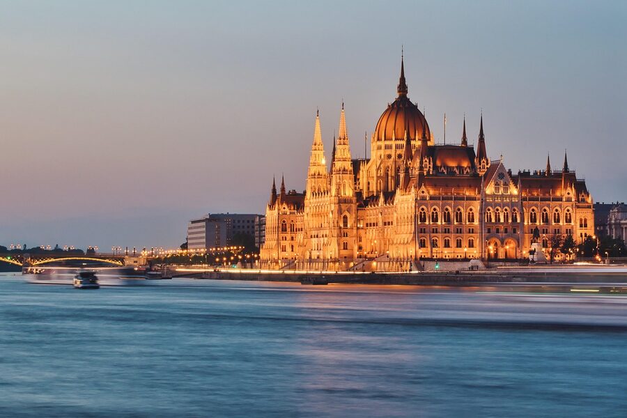 Parliament Building at dusk with reflections on the Danube in Budapest