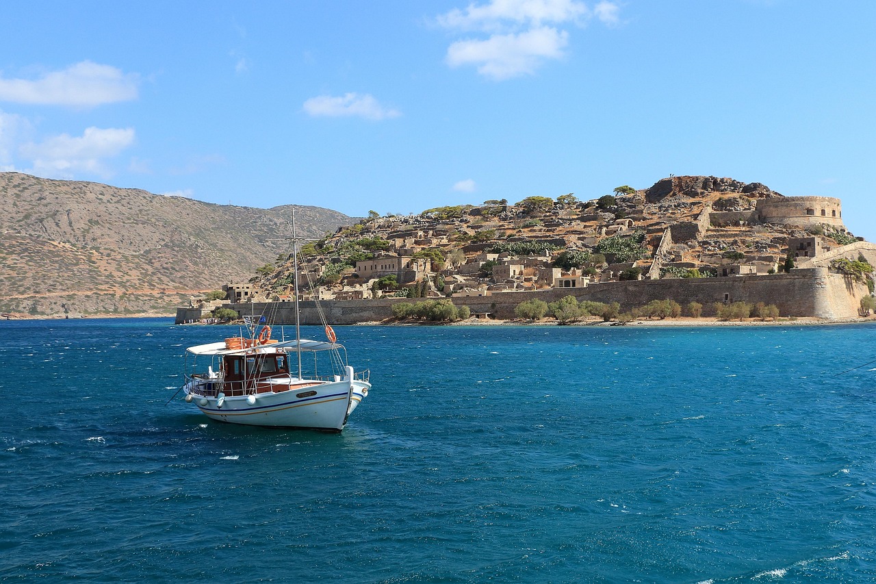 Tour boat departing from the small harbour at Spinalonga