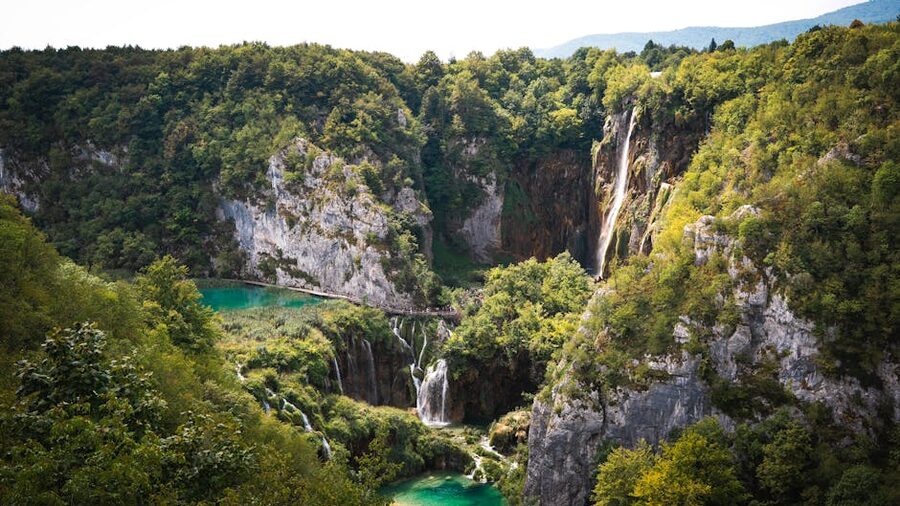 Plitvice waterfall cascading through lush greenery