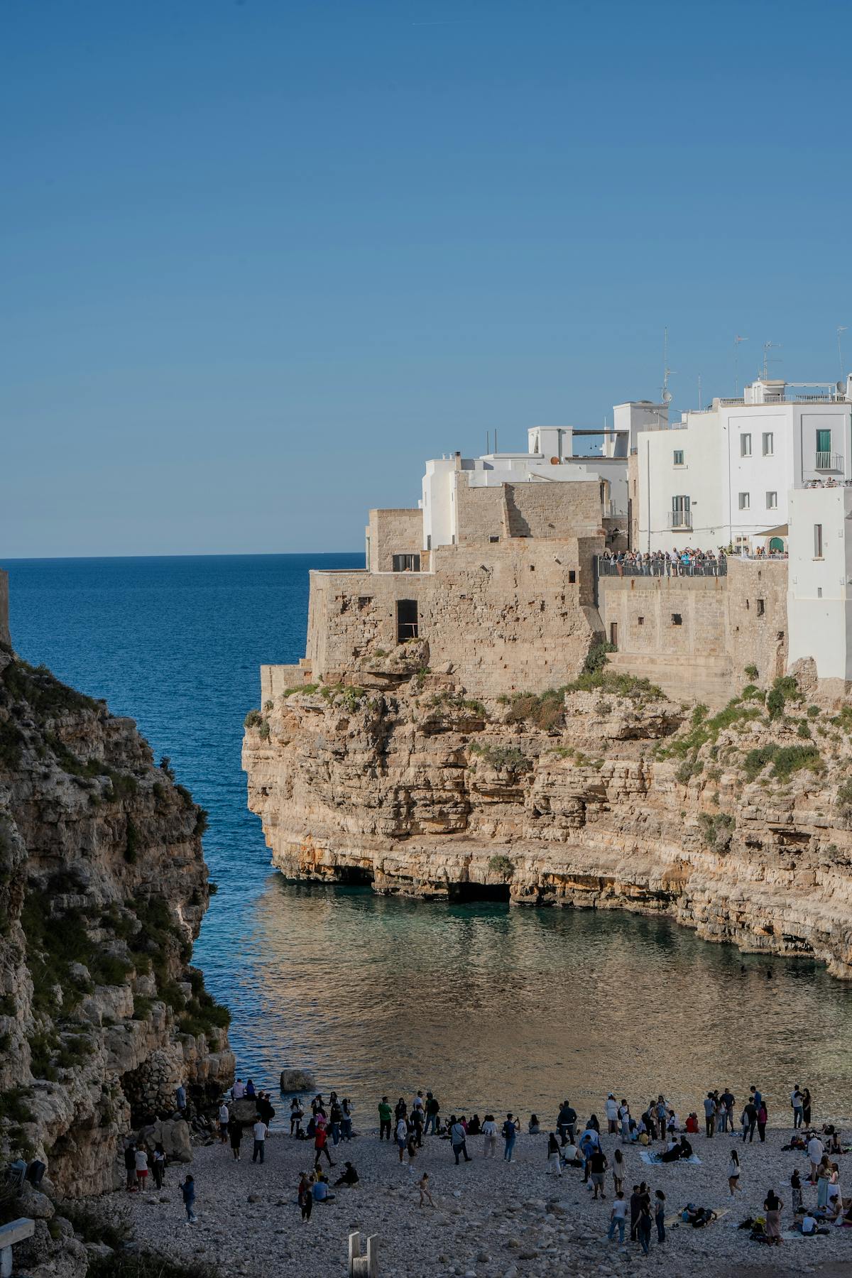 Aerial view of the dramatic cliffs and turquoise sea at Polignano a Mare Puglia Italy