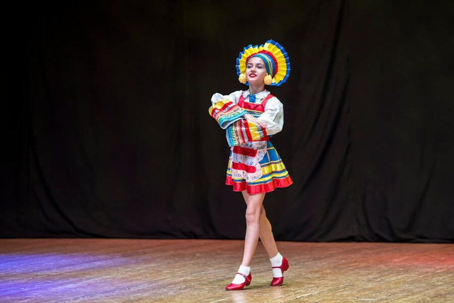 Female folk dancer in red and white costume