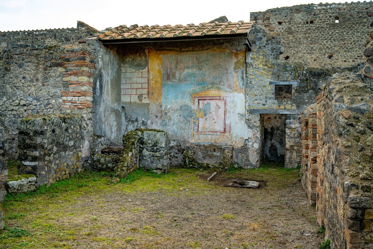 Ancient ruins of Pompeii showcasing a colorful fresco on ancient walls