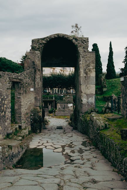Ancient ruins near Naples with green vegetation growing between weathered stone walls