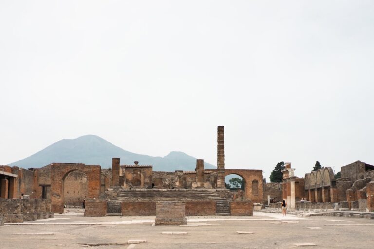 Ancient ruins of Pompeii with Mount Vesuvius visible in the background