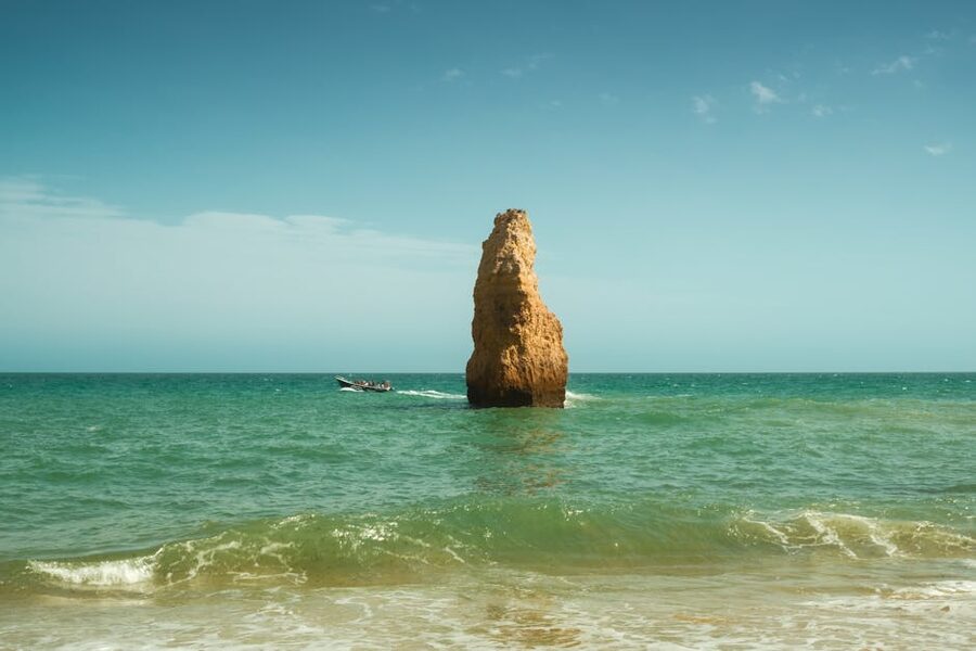 Tour boat near Ponta da Piedade rock formation Lagos