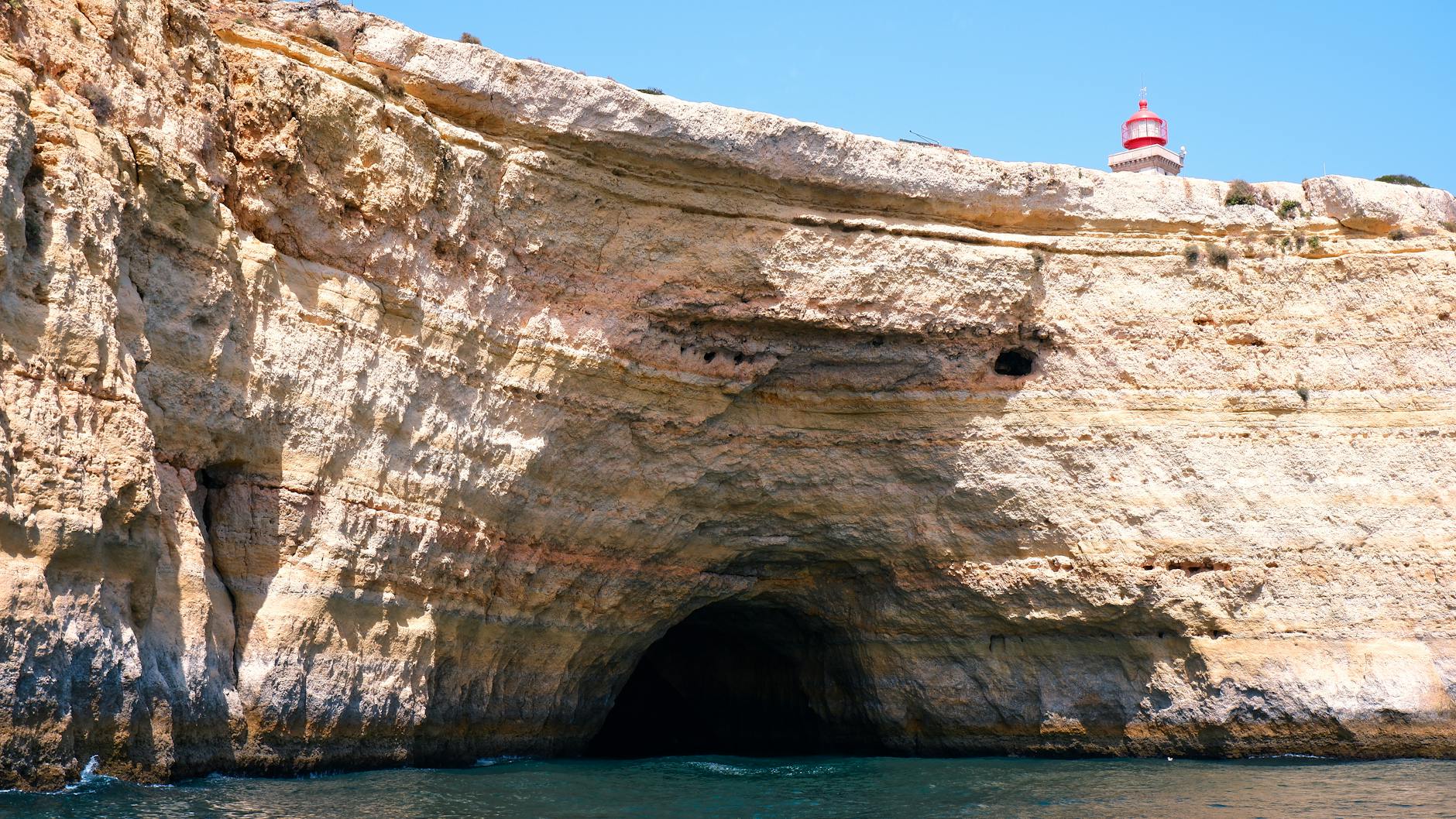 Algarve sea caves and lighthouse along the rocky Ponta da Piedade coastline