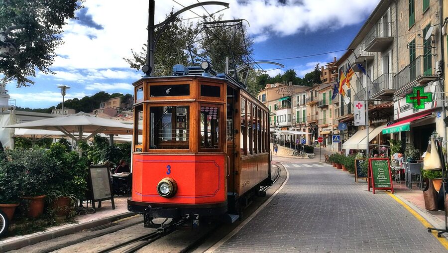 Historic tram running through Port de Soller waterfront