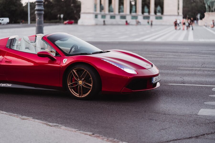 Stunning red Ferrari supercar parked on city street