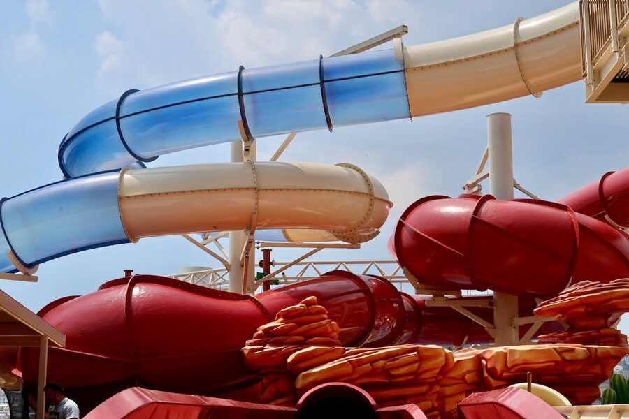 Colorful red and blue water slides at outdoor water park
