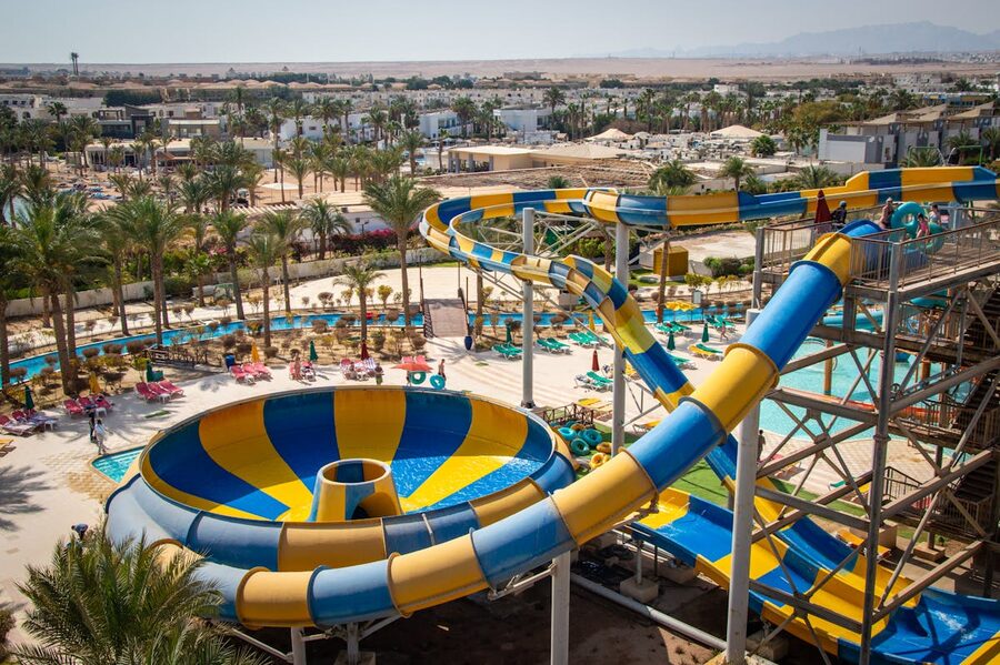 Exciting yellow and blue water slides at outdoor water park