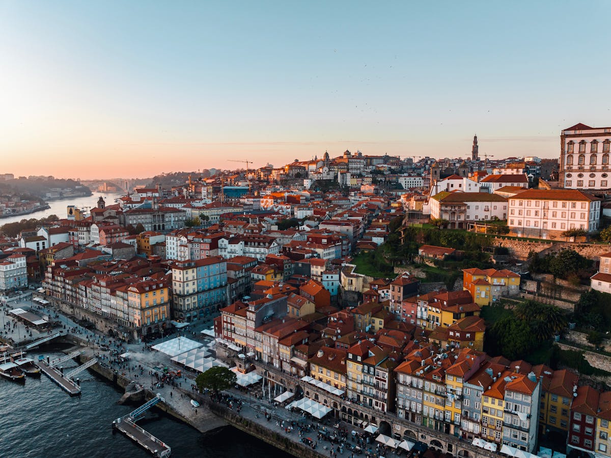 Aerial view of Porto historic cityscape at sunset with the Douro River
