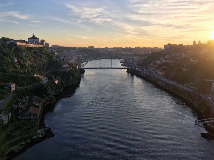 Golden hour over Douro River Dom Luis I Bridge Porto