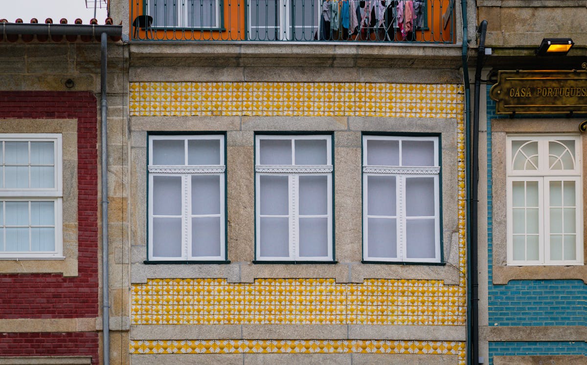 Portuguese buildings with yellow and blue azulejo tiles in Porto