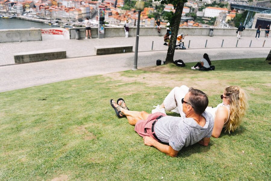 Couple enjoying the view from Jardim do Morro with Porto in the background
