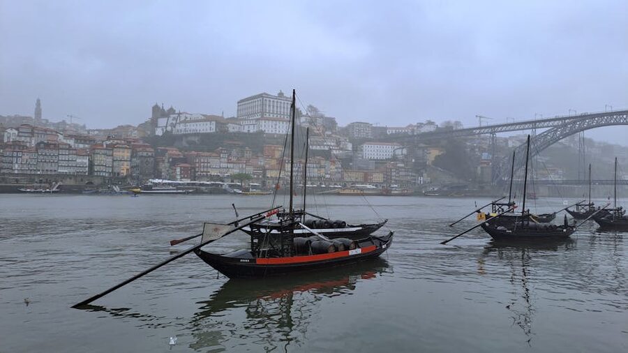 Traditional rabelo boats on the Douro River in Porto at twilight