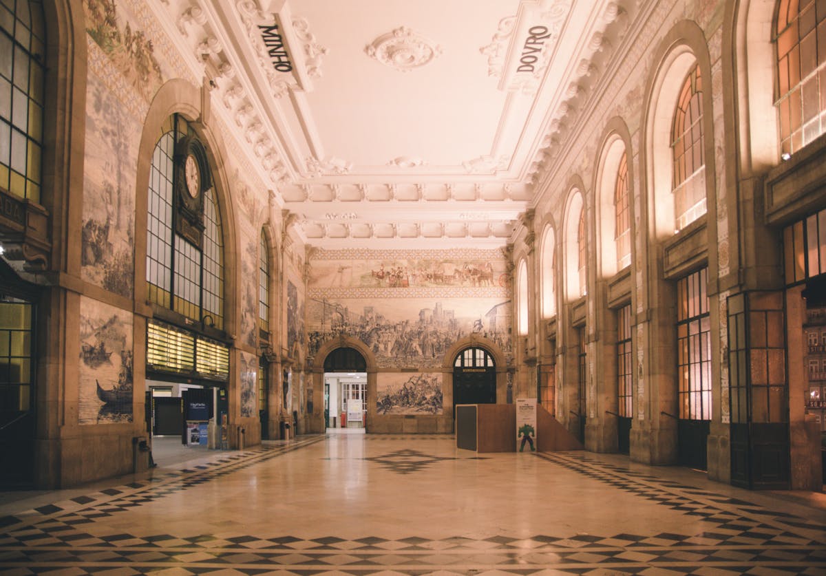 Ornate interior of Sao Bento railway station in Porto showing historic azulejo tile panels