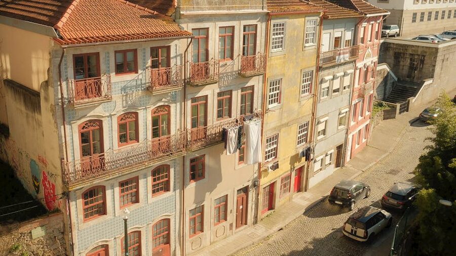 Porto street with traditional azulejo tiled facades near Clerigos