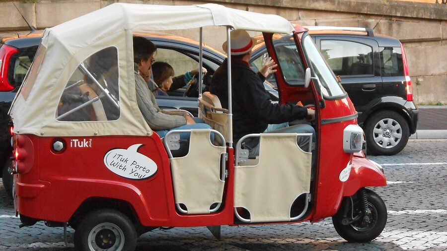 Tuk-tuk parked outside Sao Bento train station in Porto