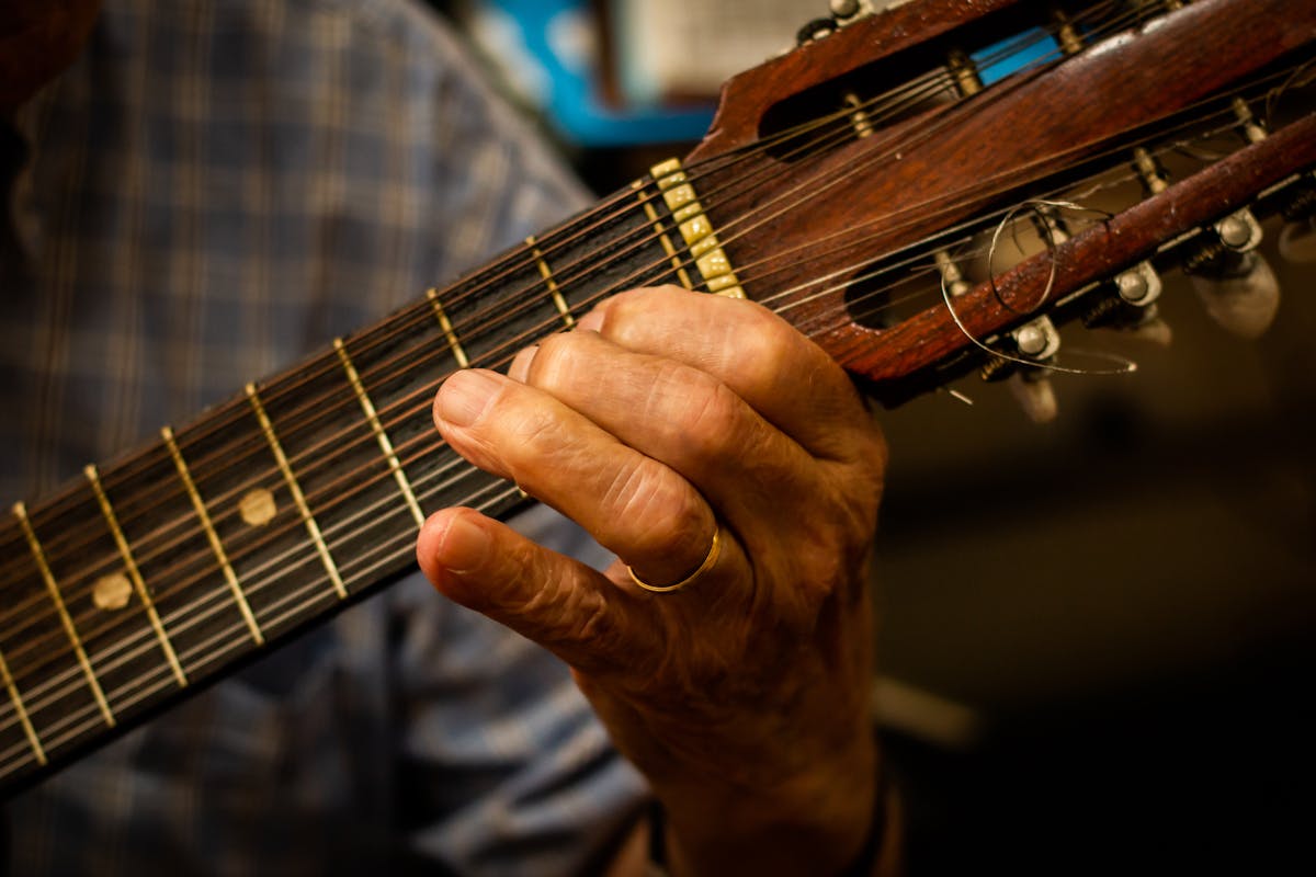 Close up of a Portuguese guitar with ornate details