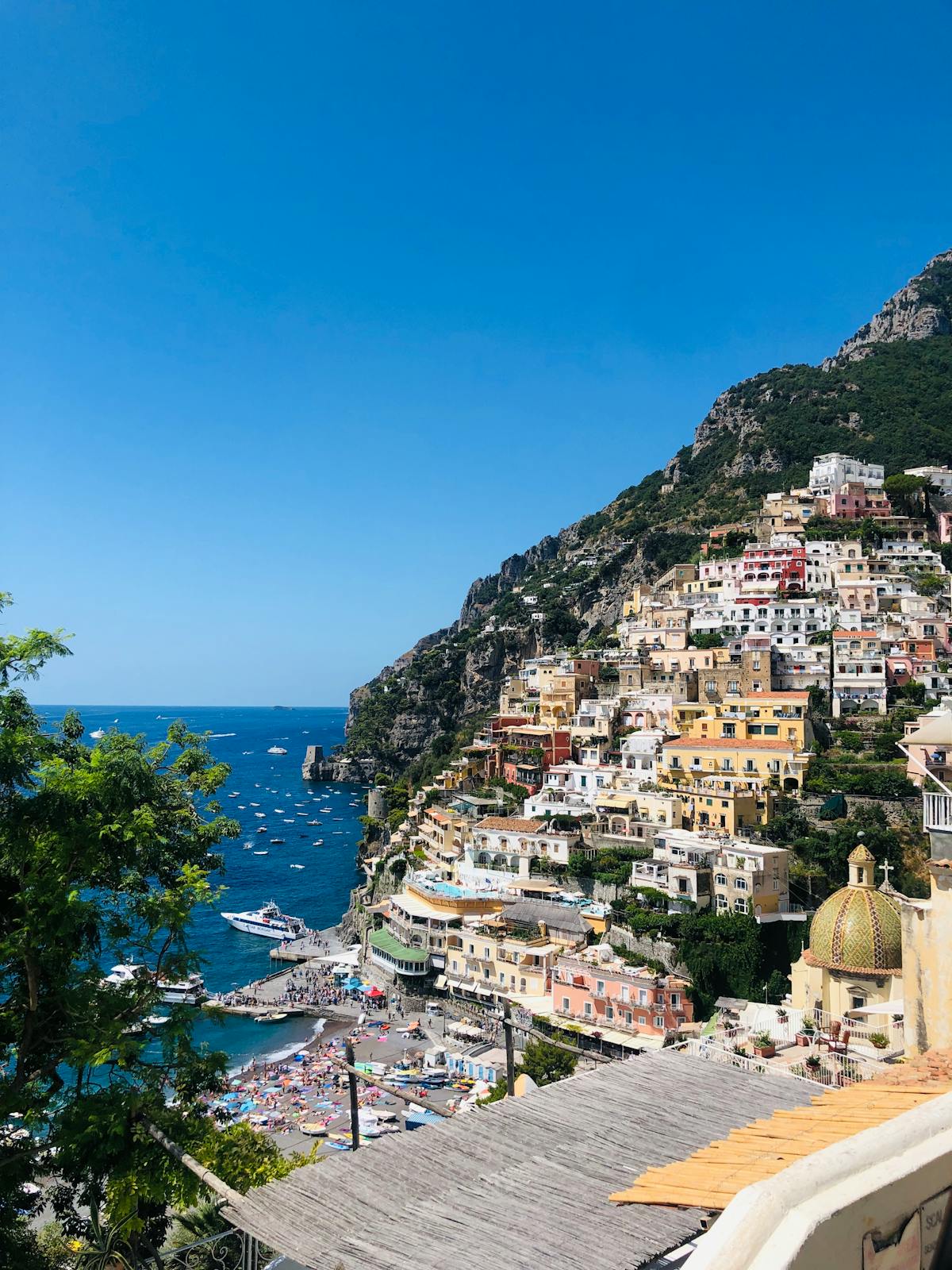 Positano cliffside village against a blue sky