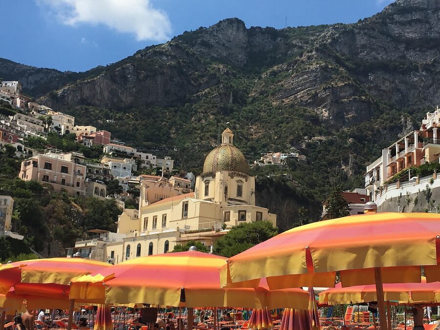 Colorful buildings of Positano cascading down the cliffside above the Mediterranean