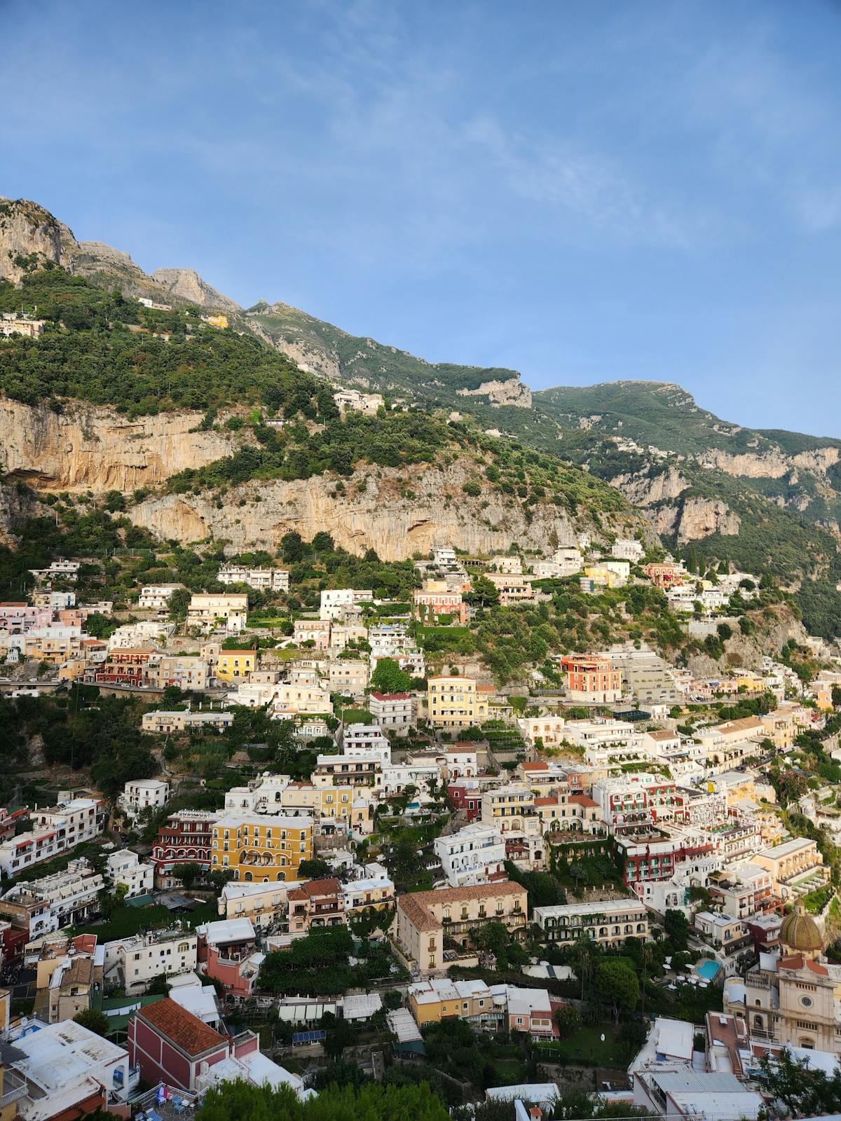 Colorful houses of Positano cascading down the cliffside to the sea
