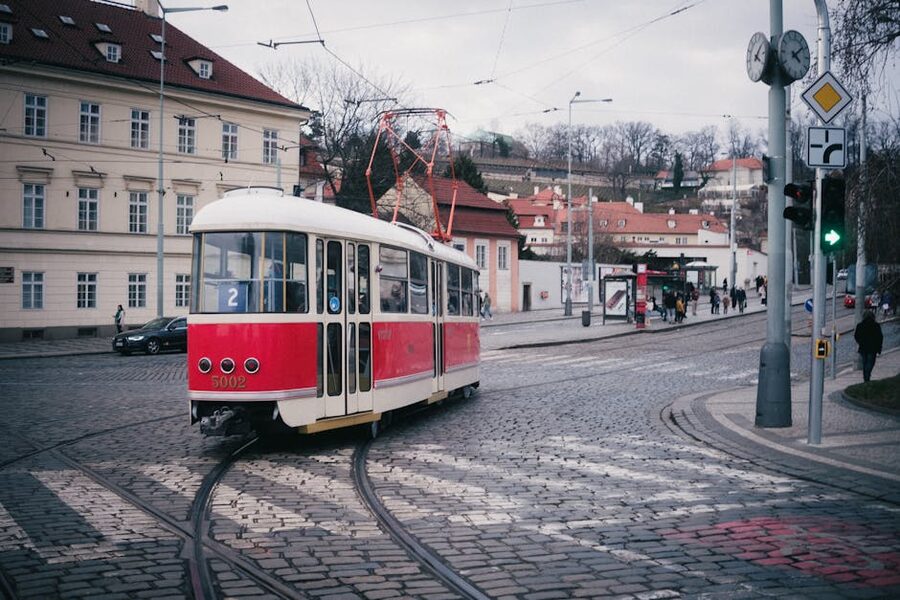 Prague red tram on cobblestone street